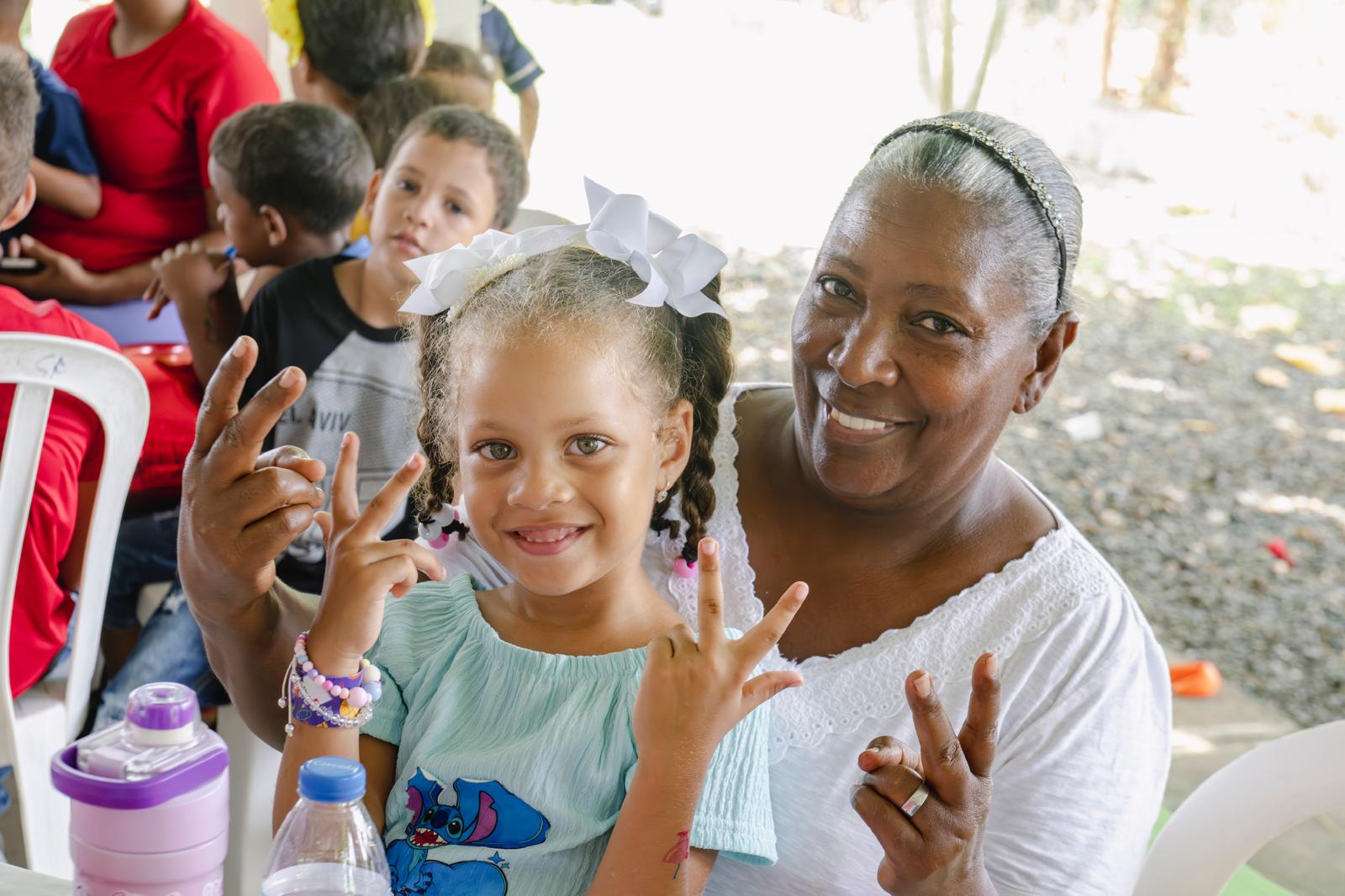 Girl and grandmother smiling at VelRod event