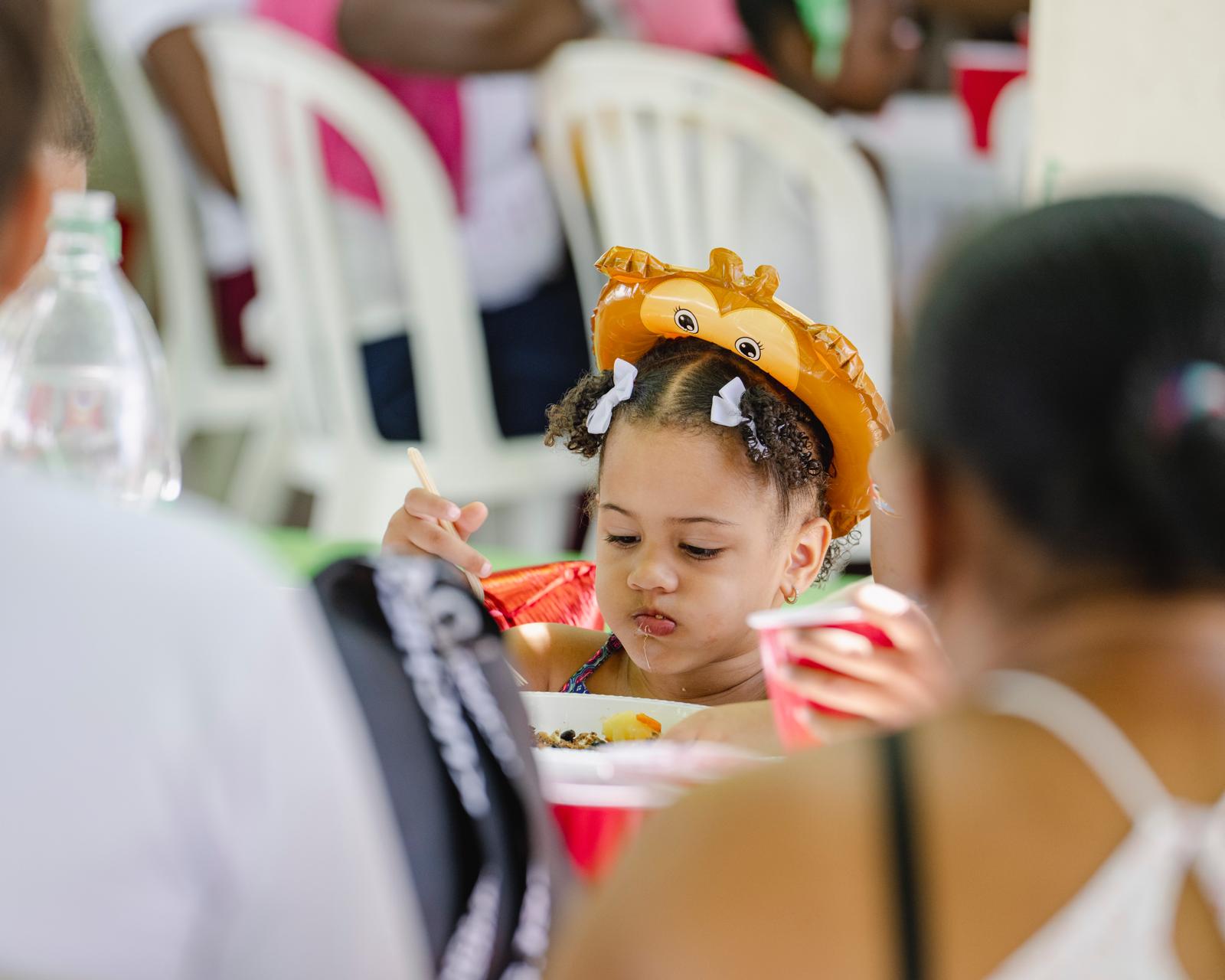 Child eating a meal at a VelRod community event