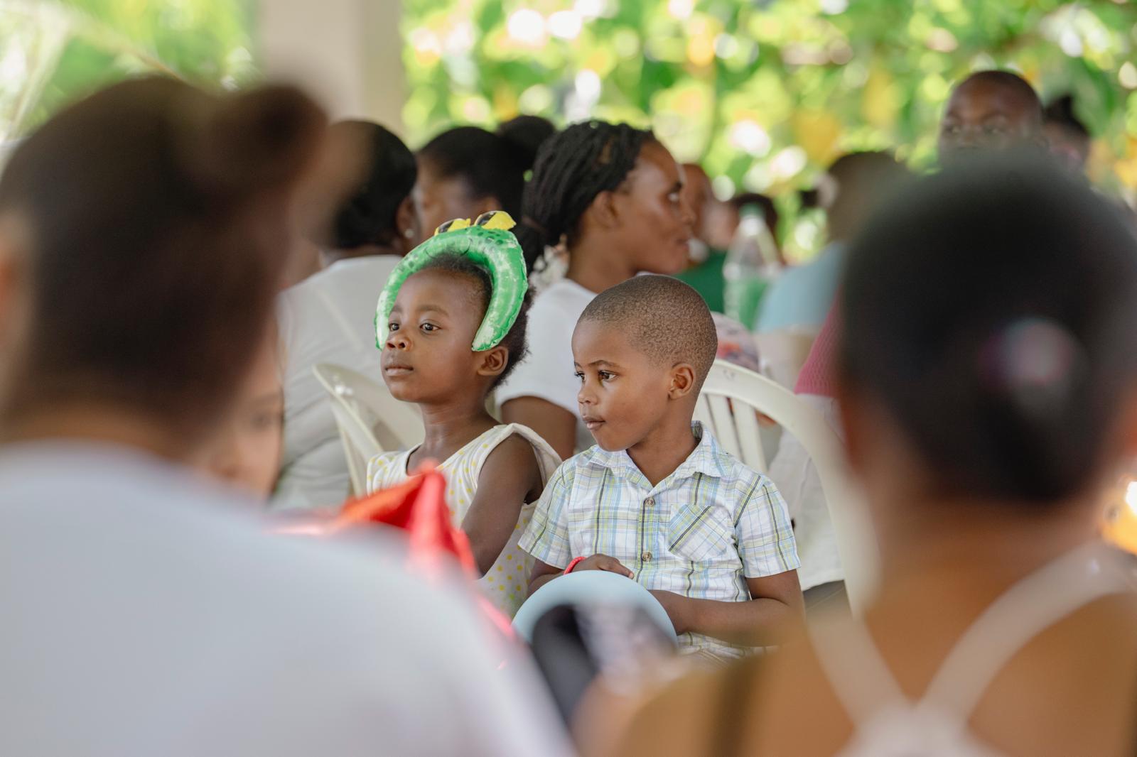 Children listening attentively at a VelRod event