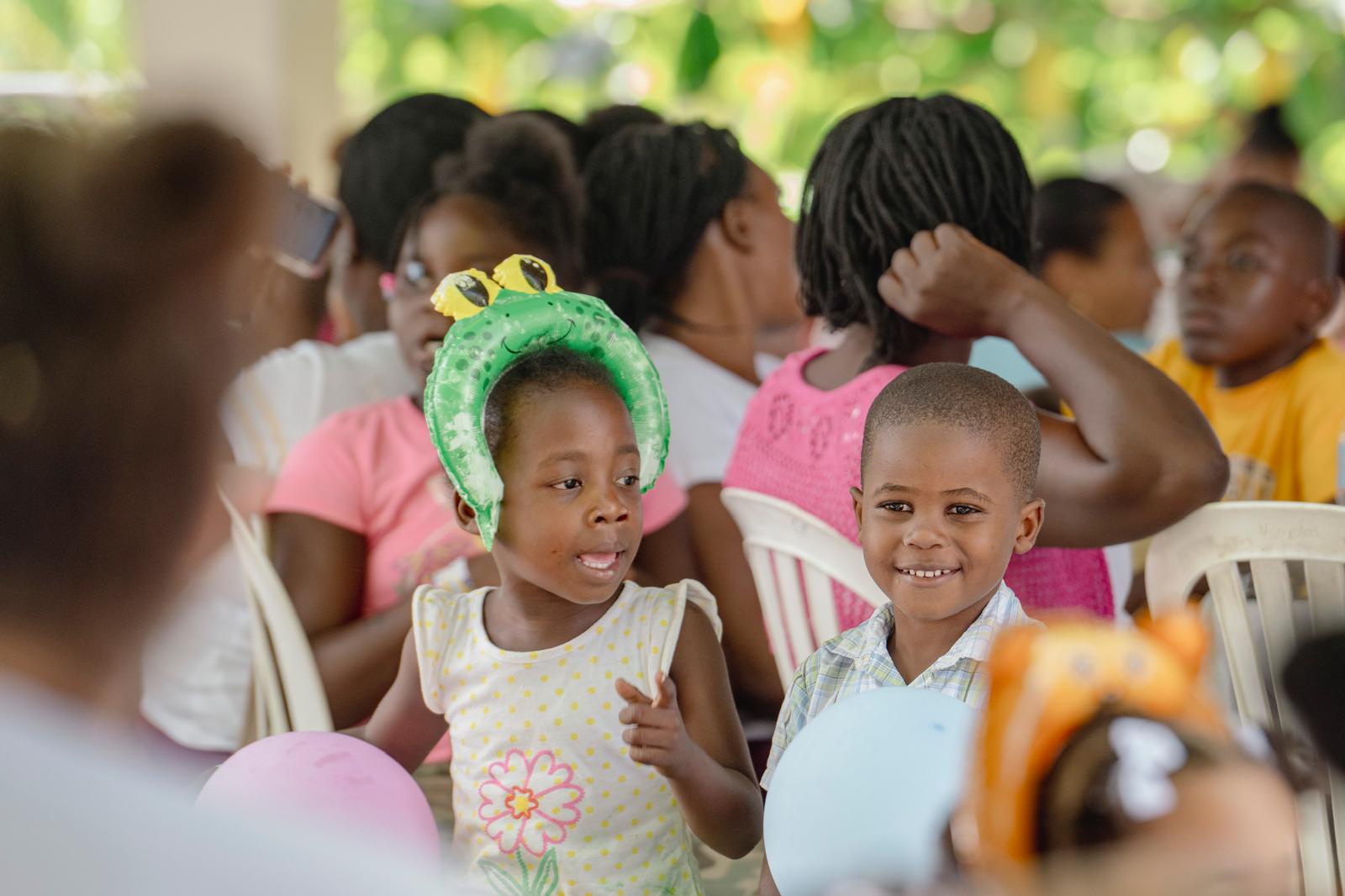 Two children smiling at a VelRod Charity event