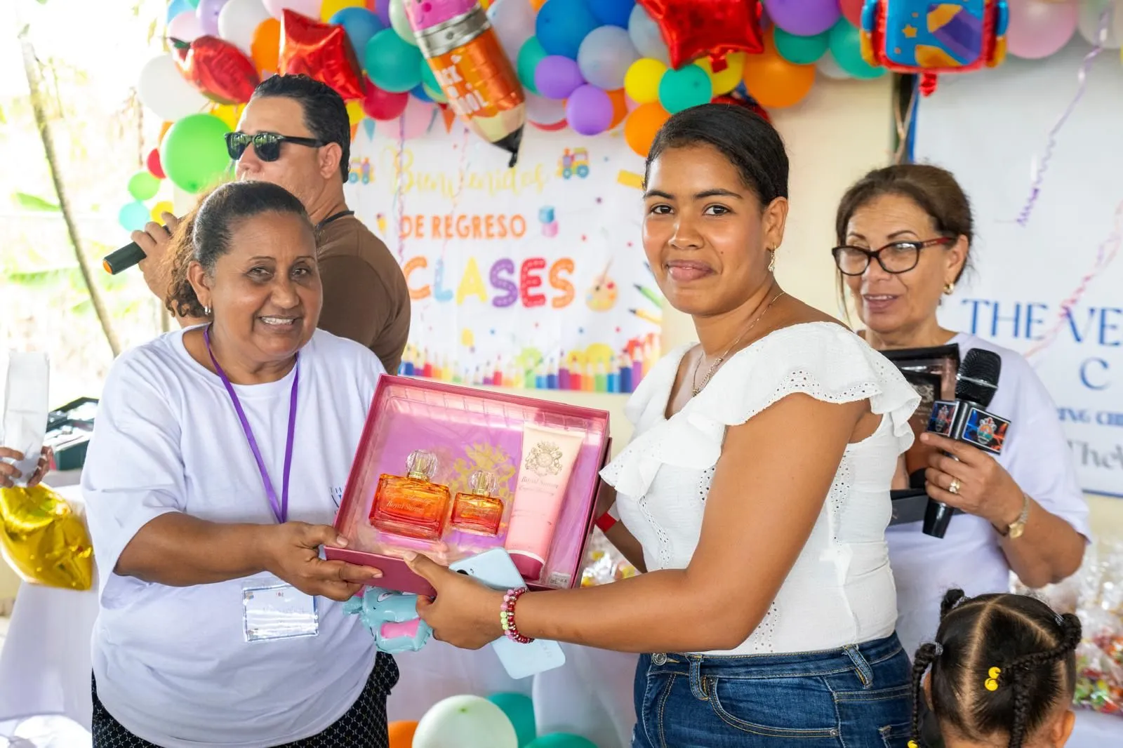 A mother receiving a raffle prize