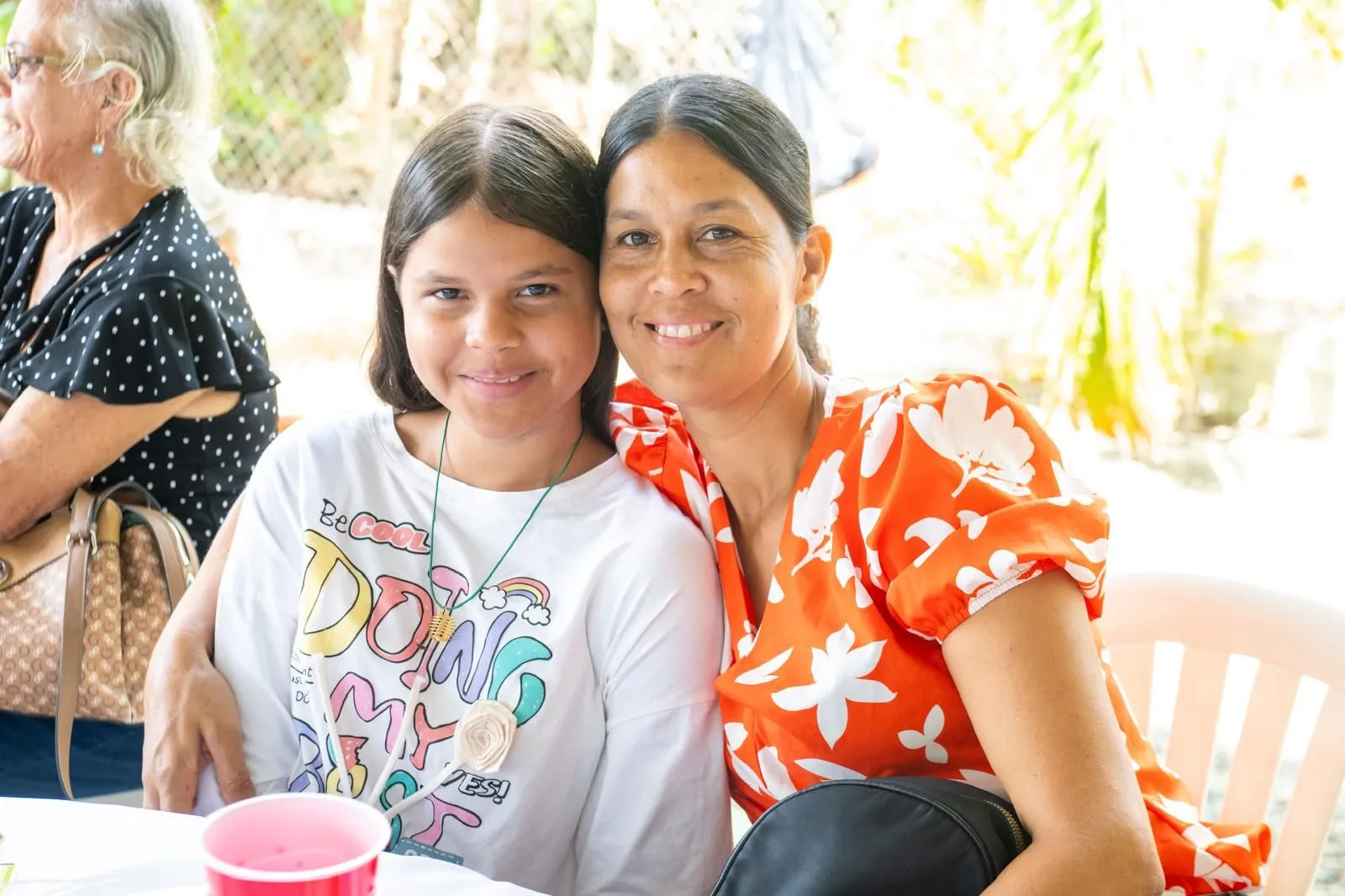 A mother and daughter at the celebration