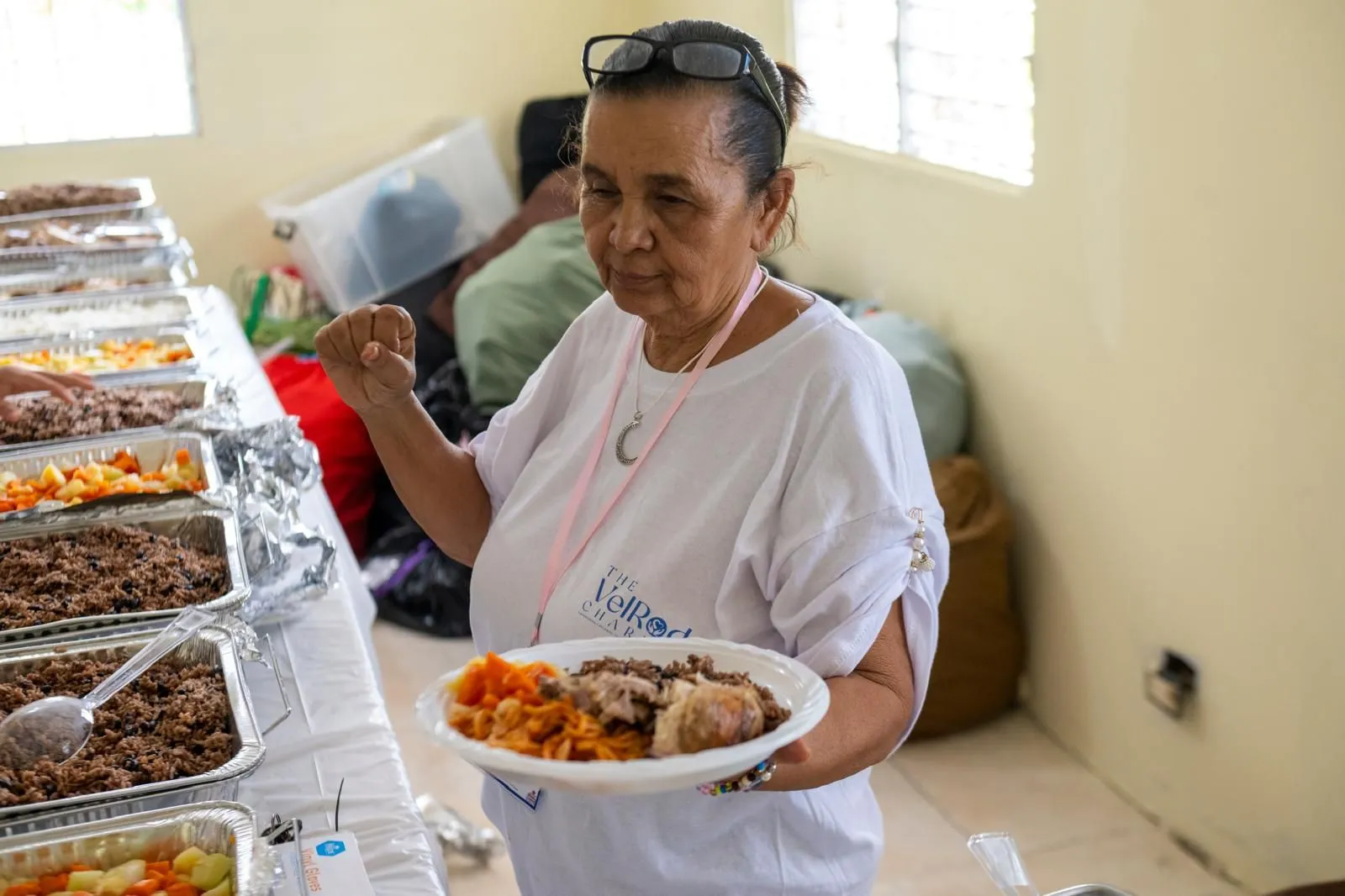 A volunteer with a plate of food