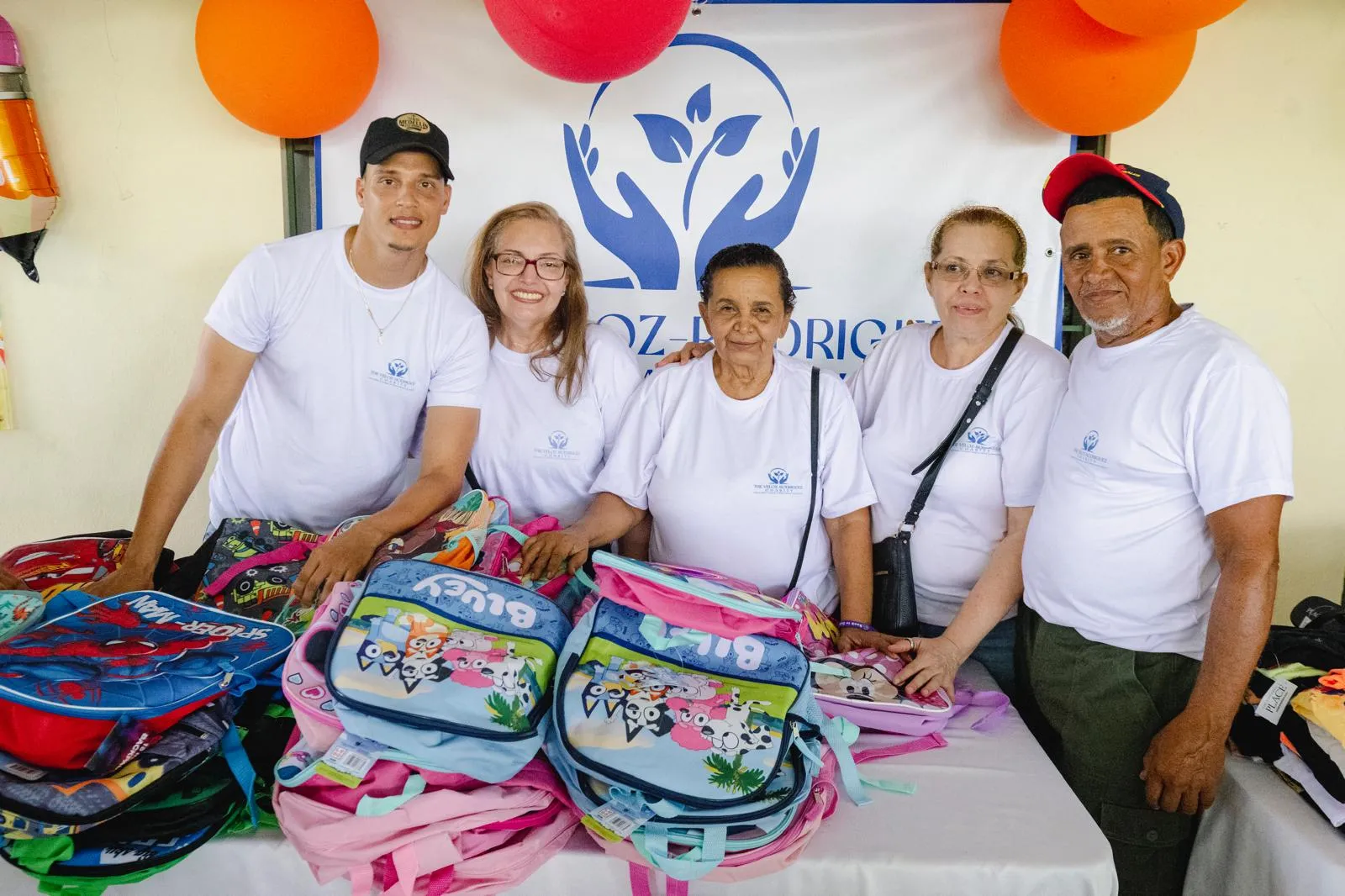 Volunteers with backpacks ready for distribution
