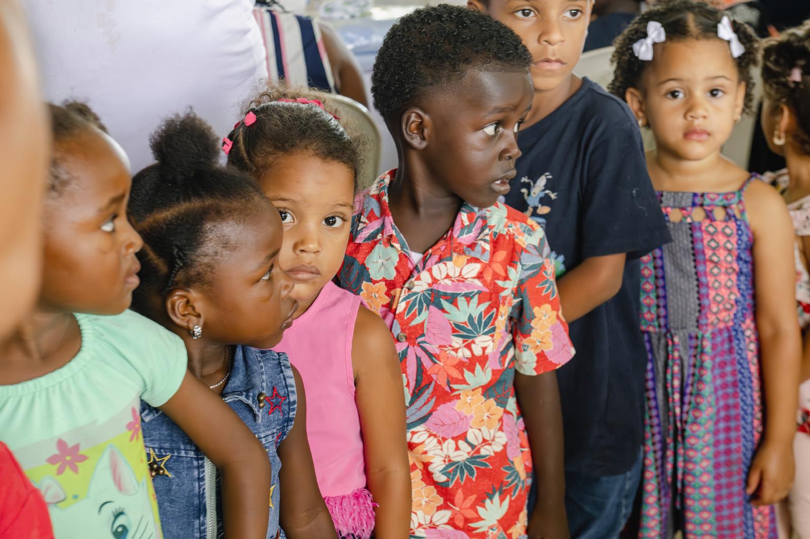 Children waiting attentively at a VelRod Charity event in the Dominican Republic